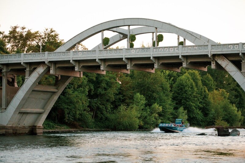 bridge with jet boat driving under