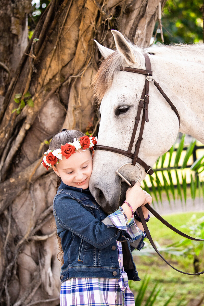 daytona florida equine photography of a girl snuggling her cheek into her grey horse's nose