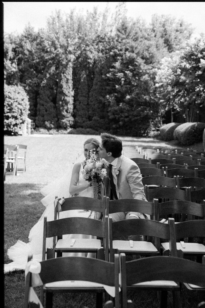 Groom kisses bride as they share an intimate moment before their wedding at the Cordell in Nashville. 