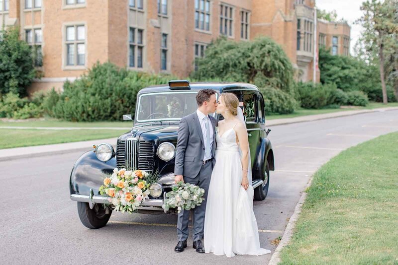 Grey Loft Studio - Bethany and Luc Barette - Wedding Photography Wedding Videography Ottawa - Couple Kissing IN Front of Vintage Car