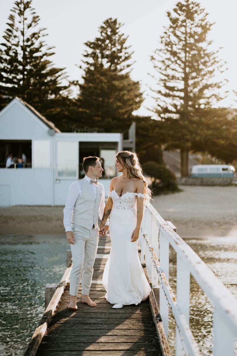 Bride and groom hugging each other.