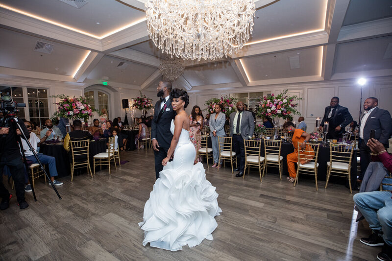 Swank Soiree Dallas Wedding Planner JacqueRae & Rashard - Bride and Groom under a chandelier at reception