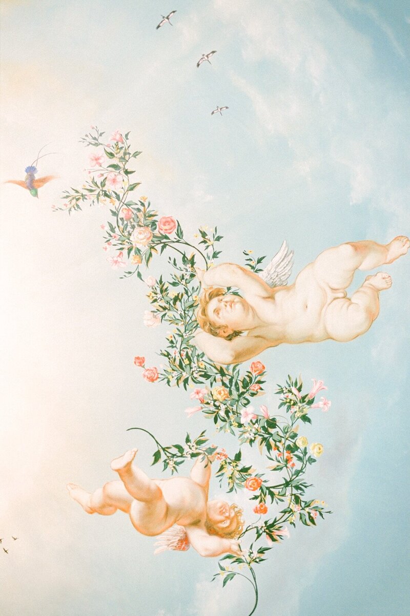 Fetcham Hall ceiling mural of two angels with pastel flower garland