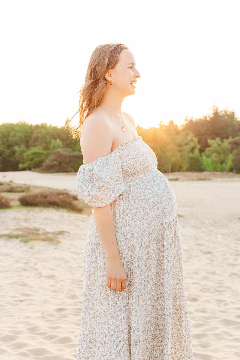 magical pregnancy photoshoot during sunset in the dunes