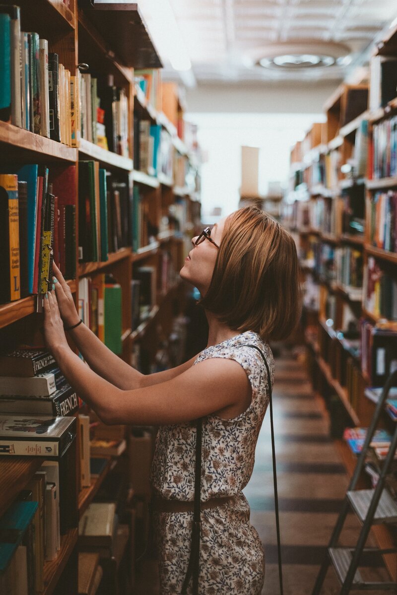 College student in library looking at book in North Carolina