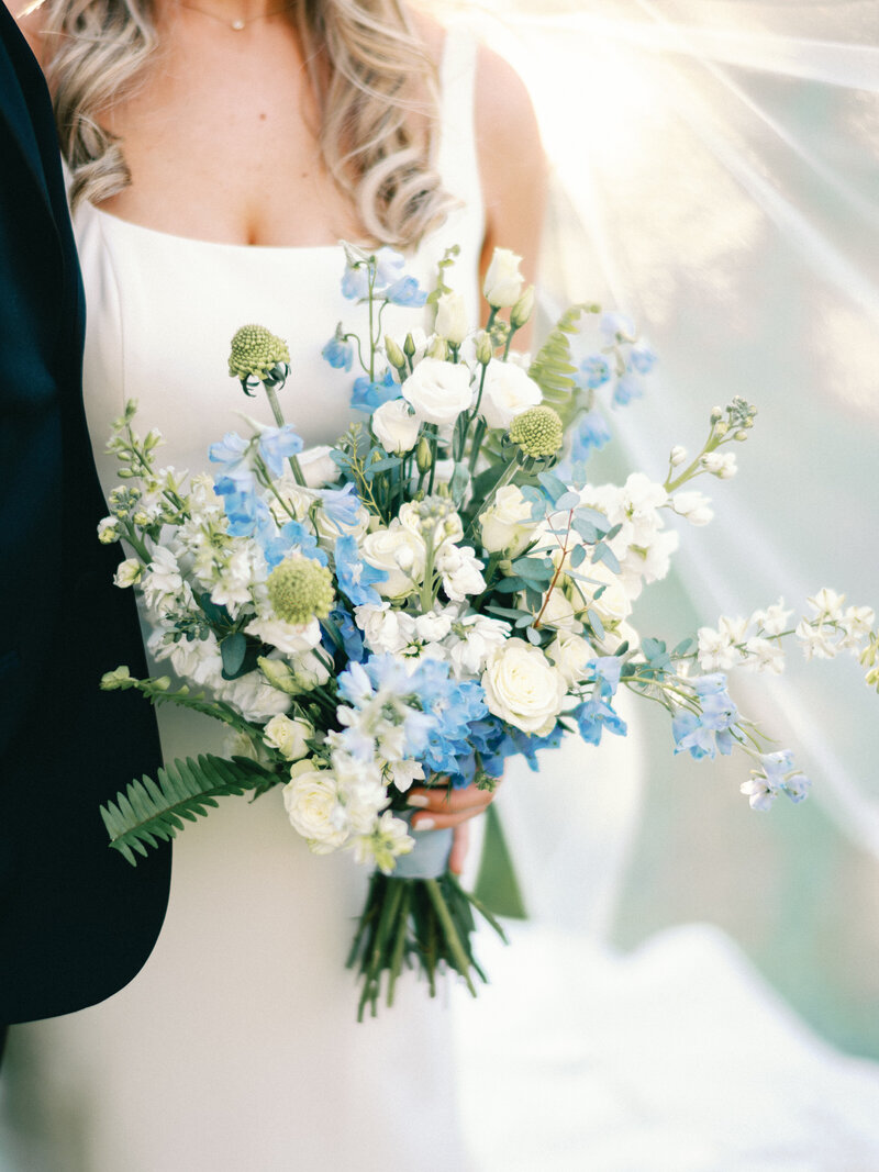 Bride and Groom blue bouquet at Posey Meadows San Marcos Texas