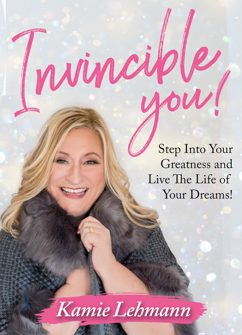 Book cover with text "Invincible You! Step into your greatness and live the life of your dreams!"