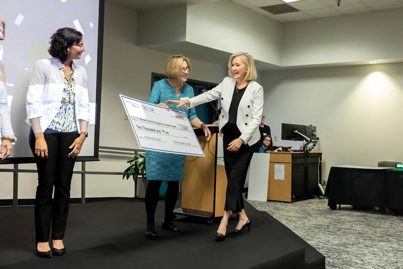 Dallas corporate brand photography by Sophie K. Hunter capturing a polished, professional moment during a branded business event.