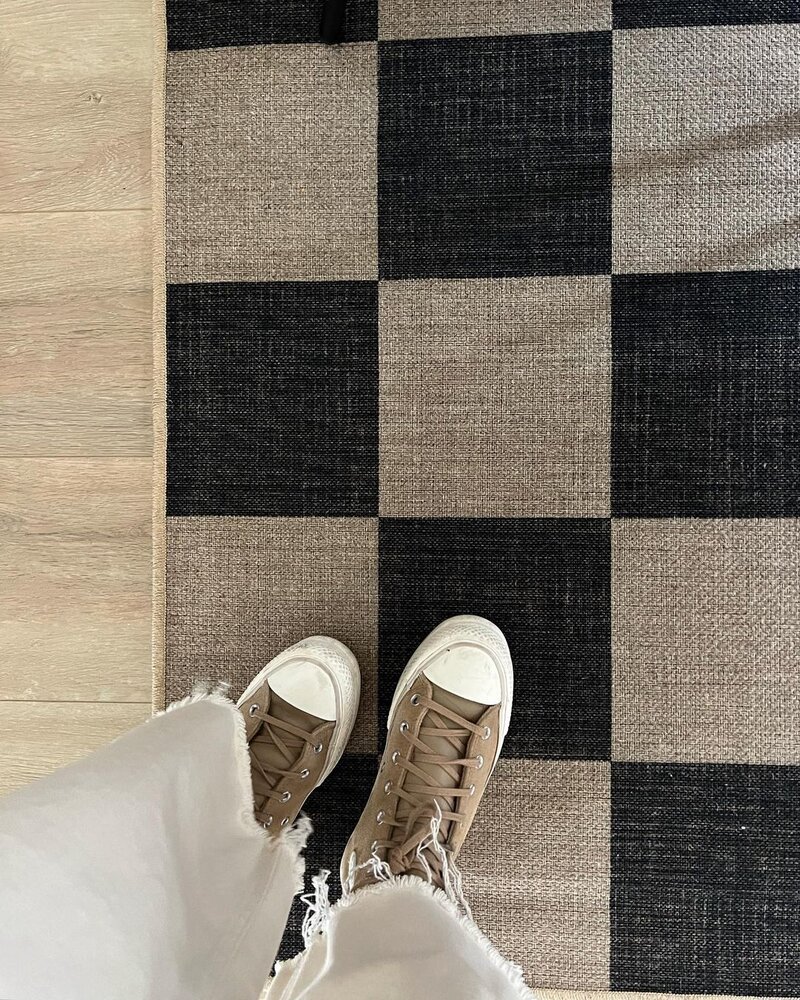 Brand photography for an interior design studio showcasing a textured checkered rug