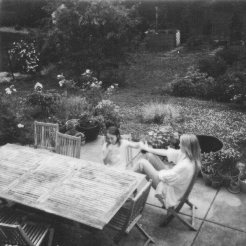Chicago film photographer Suzy Brown with her family in their garden.