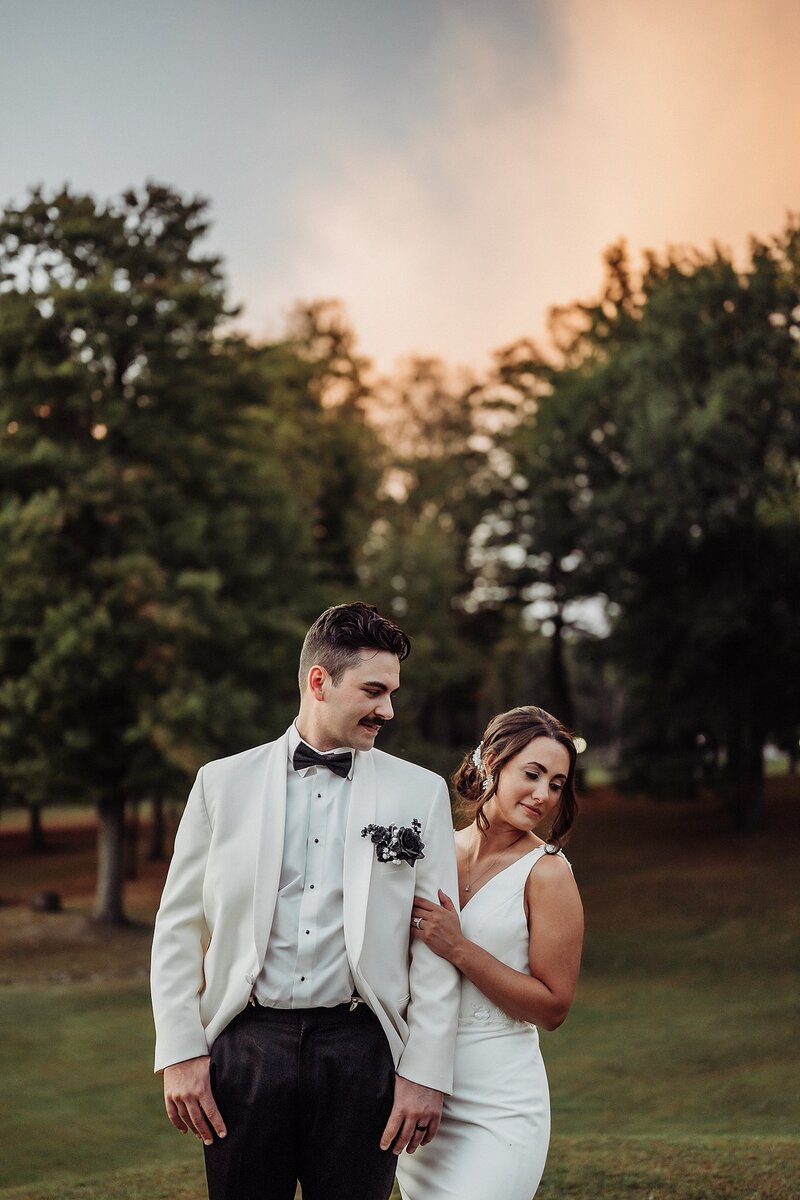 Bride and groom at Majestic Woods for sunset portraits