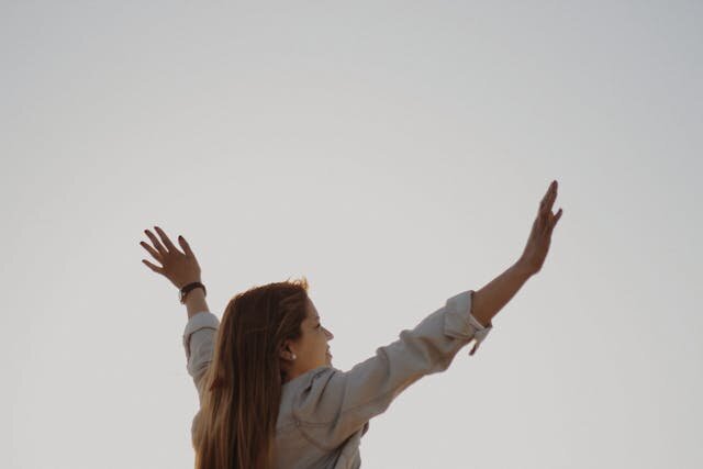 woman with hands in the air