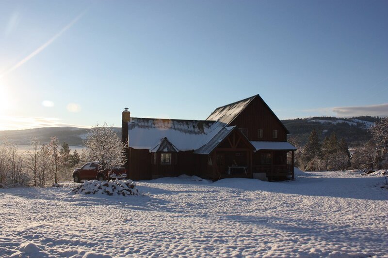 House in the mountains with snow on the ground