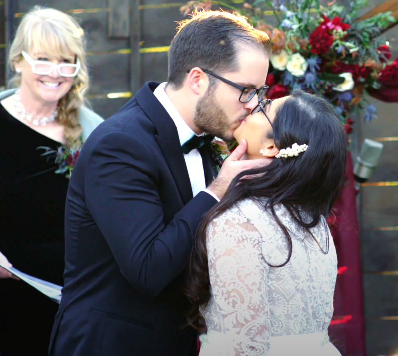 Portrait of bride and groom singing at their wedding in San Francisco