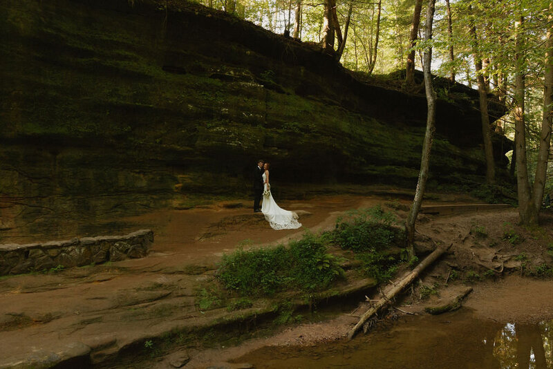 couple hiking in hocking hills for their elopement day