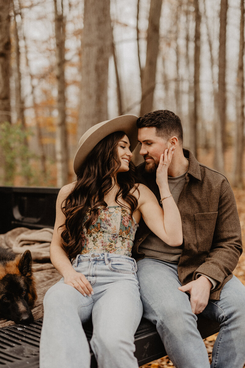 engaged couple photo session in the woods