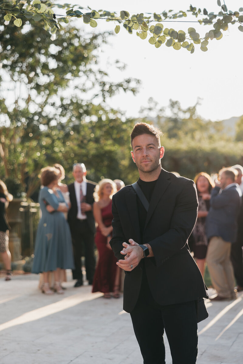Wedding videographer holding a cup of coffee