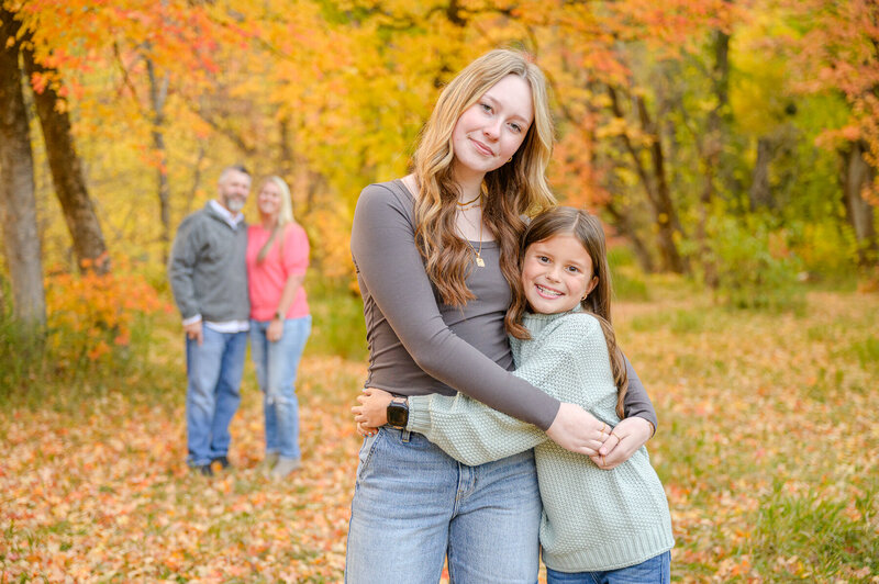 utah family photographer of family posed at the poppy field at lambert park in alpine utah 