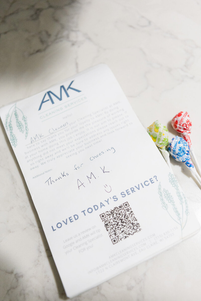 Notepad with AMK cleaning services logo with a note from the cleaning crew