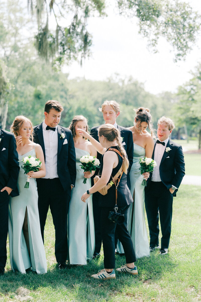 Wedding photographer Rachel Linder sitting and holding a camera