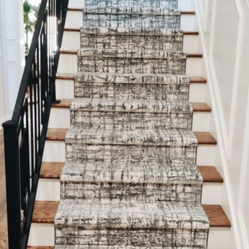 A black and white stair runner carpet.