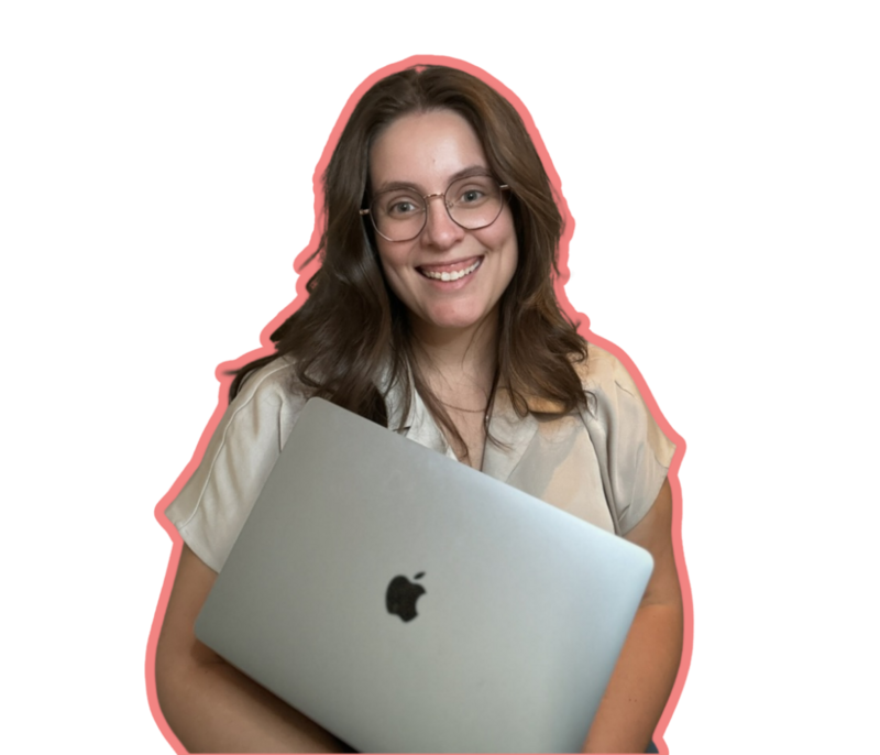 Smiling woman with glasses and brown hair, holding a silver laptop, representing Molli Gorrell, virtual assistant and web designer for small businesses.
