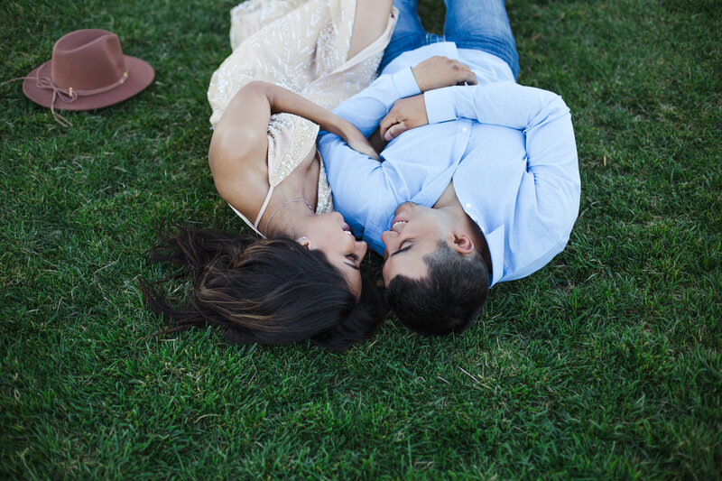 couple laying in grass in Knoxville engagement session