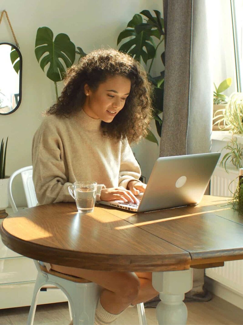 Woman at computer not wearing pants