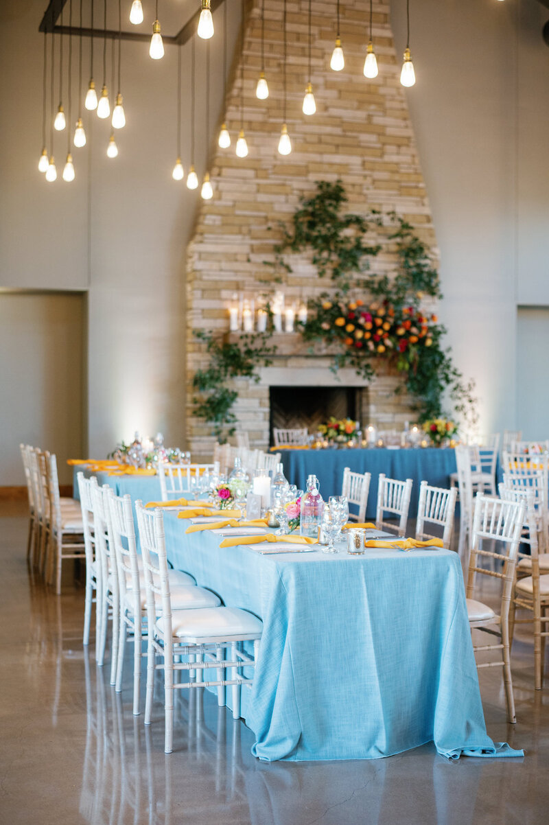 Reception decor in Canyonwood Ridge hall with romantic lighting and Hill Country details