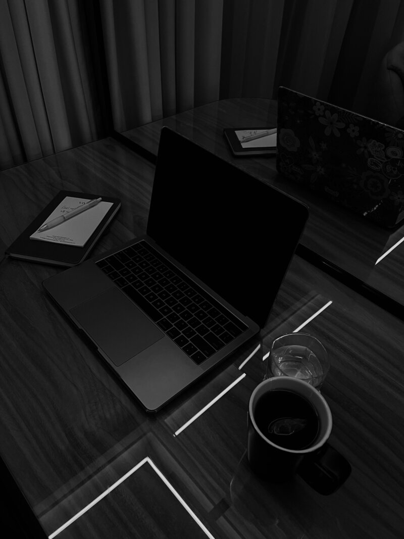 laptop and drink on a desk