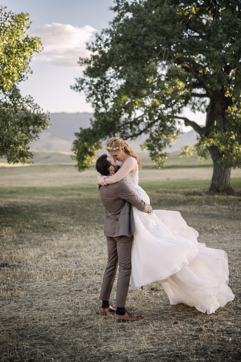 bride and groom with horse at mountain wedding