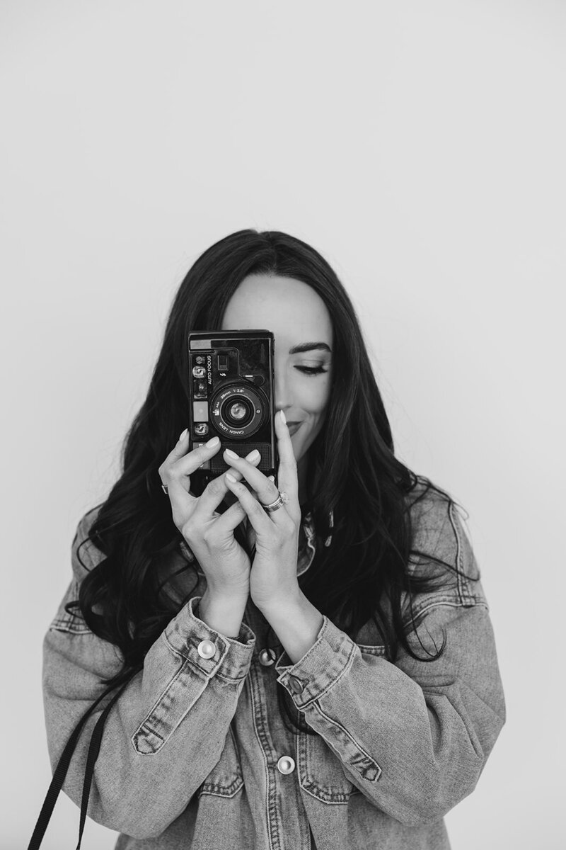 Photographer branding shoot holding camera