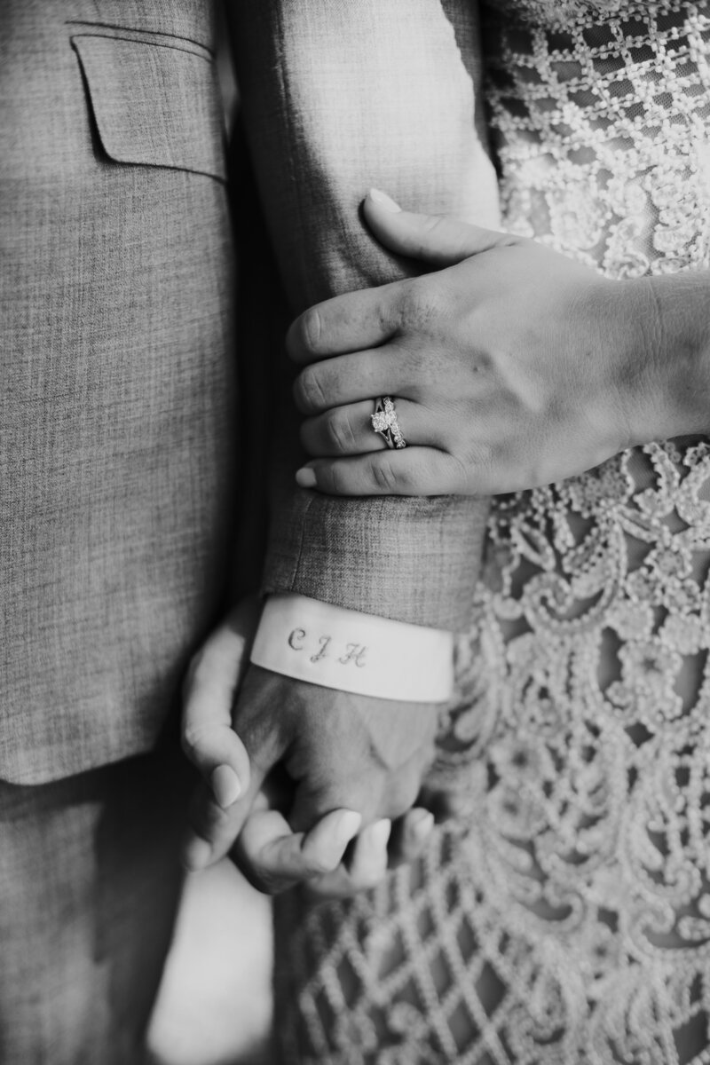 couple holding hands on wedding day