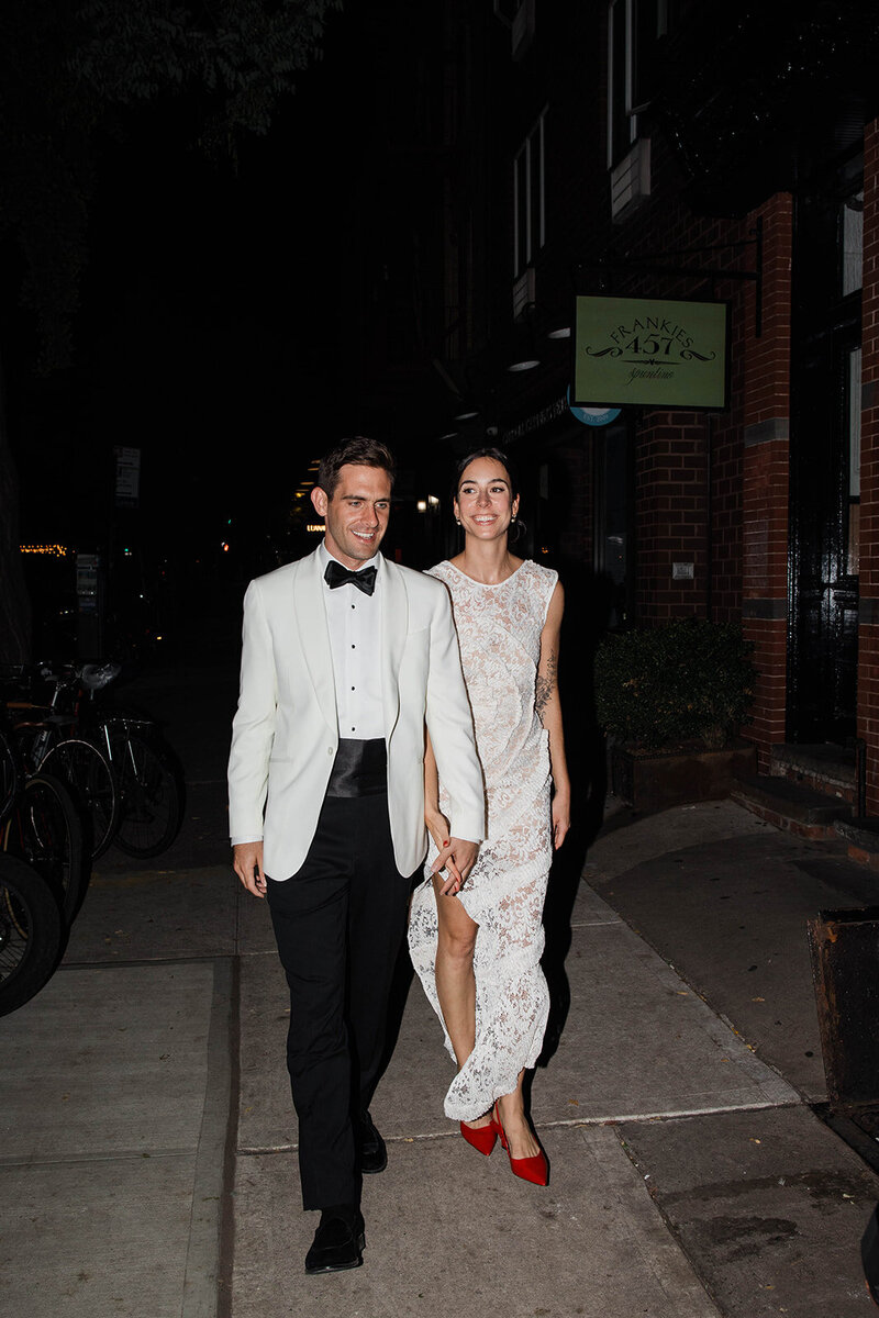 Flash photo of bride and groom cutting cake