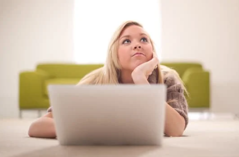 young girl day dreaming whilst on her laptop; Getty Images  scale cutout ; Billion Photos