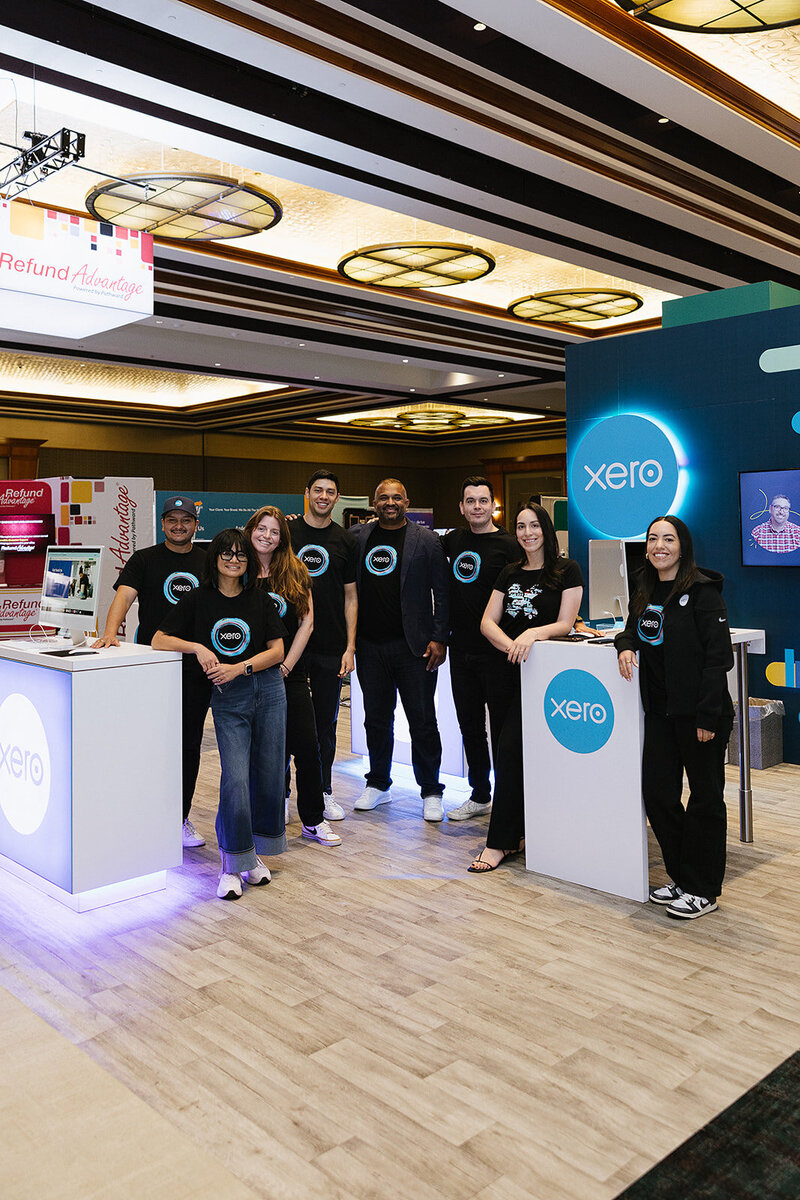 xero team at a conference at their station 