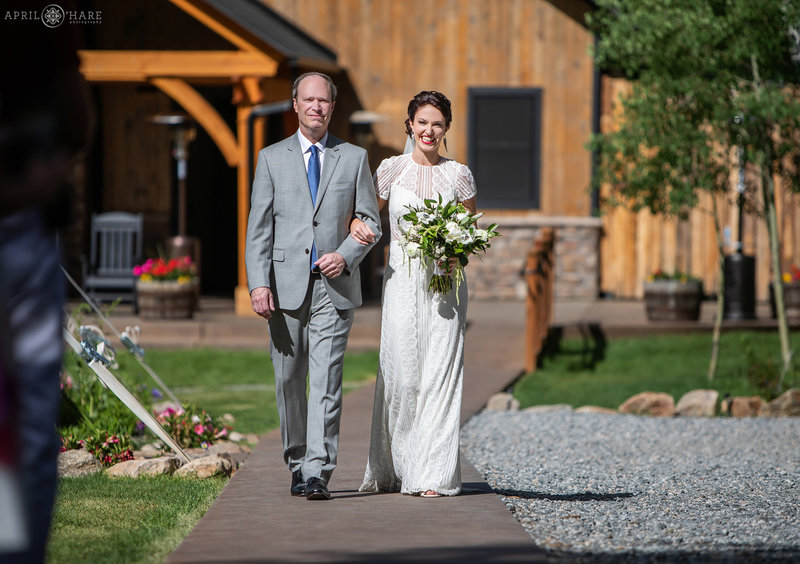 Outdoor sunny wedding day at Blackstone Rivers Ranch in Colorado