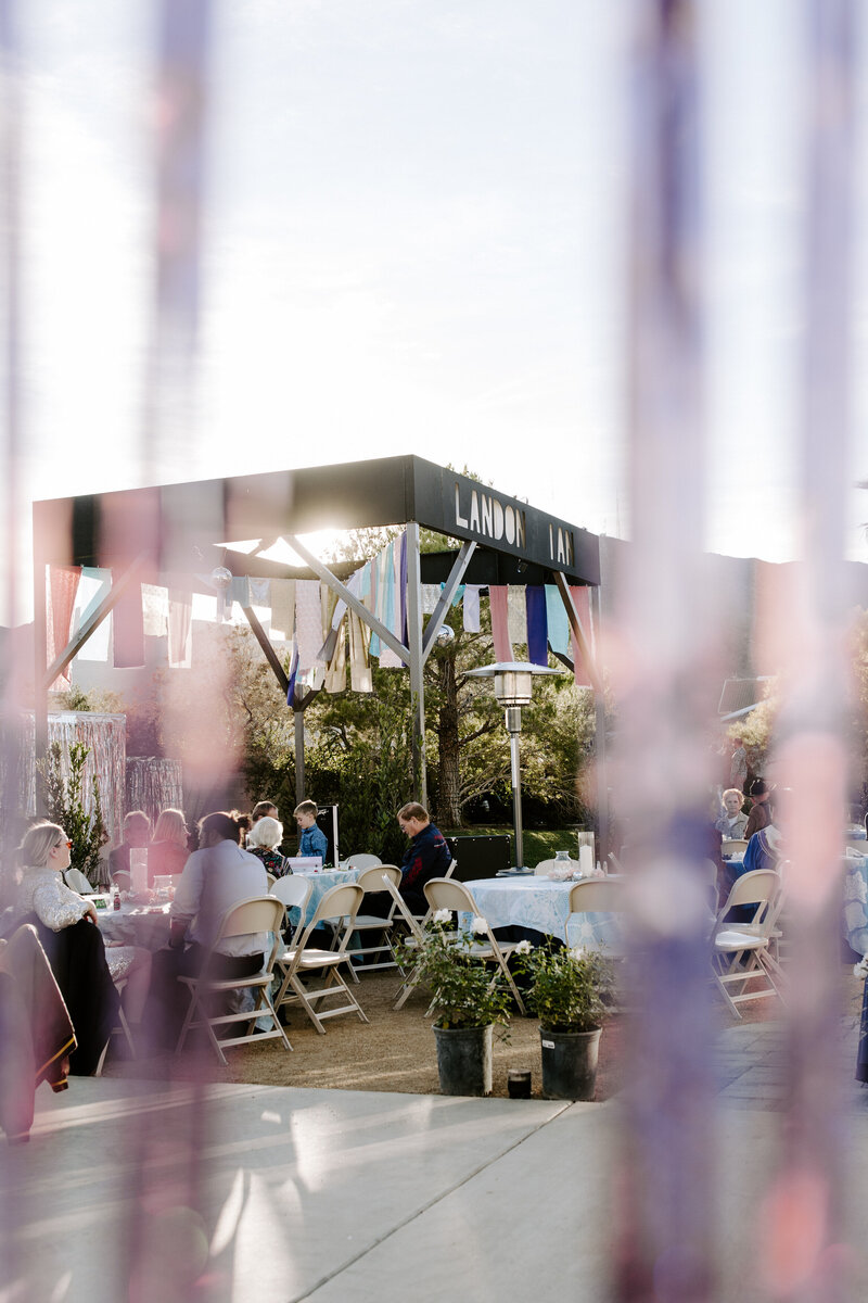 Guests sit at tables