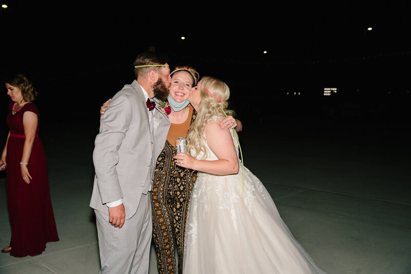 Jackson Hole photographers capture bride and groom kissing Jackson Hole photographer during wedding
