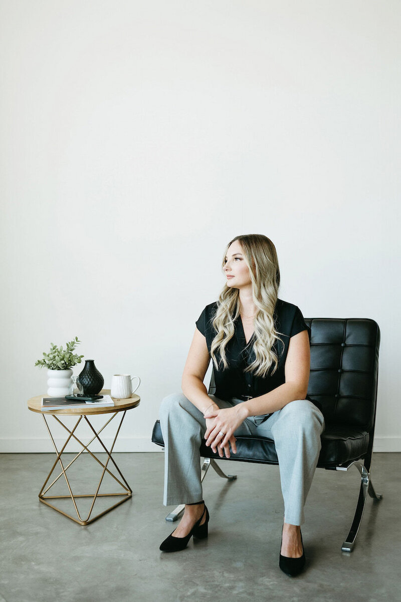 Karly Whitaker setting up custom HoneyBook workflows and automations for a service-based business owners.