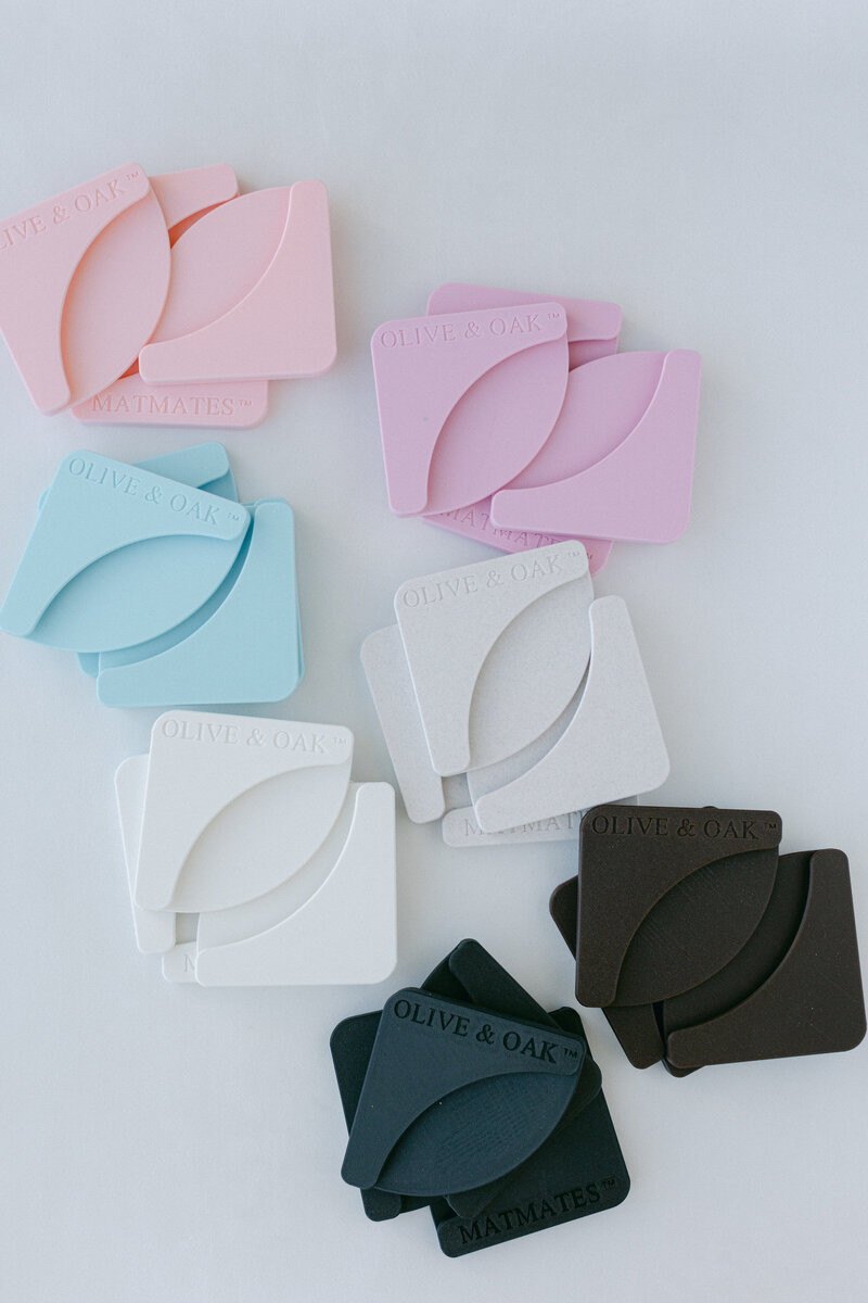 Mat Mates used to hold down styling mat corners for stable flat lay photography