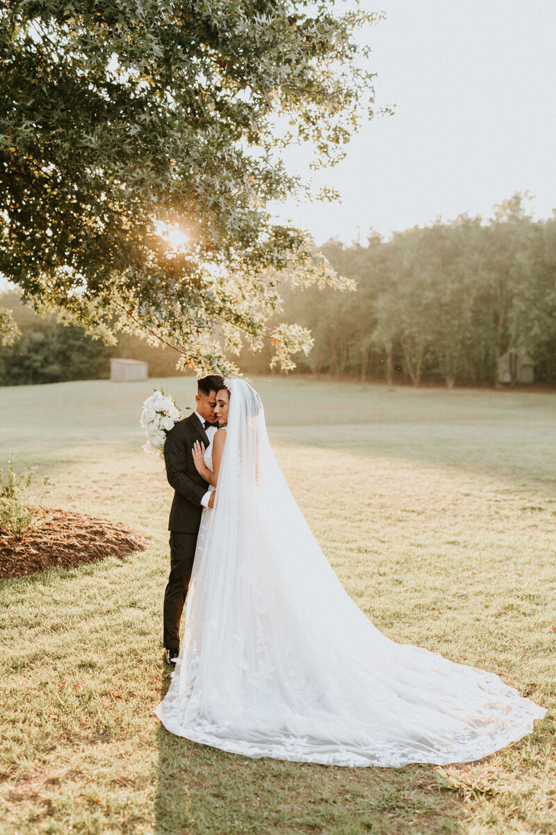 Bride and groom at sunset at Raleigh wedding