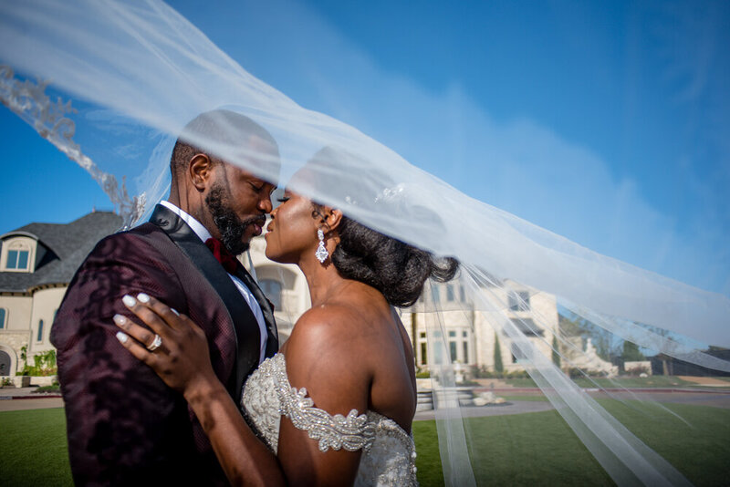Swank Soiree Dallas Wedding Planner Victoria and Ruke at Knotting Hill Place - Bride and Groom kissing