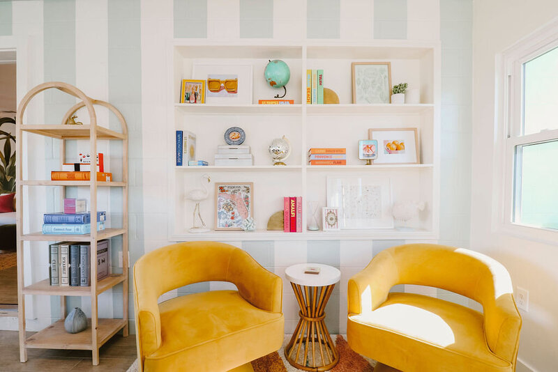 built in shelves yellow chairs with bamboo table