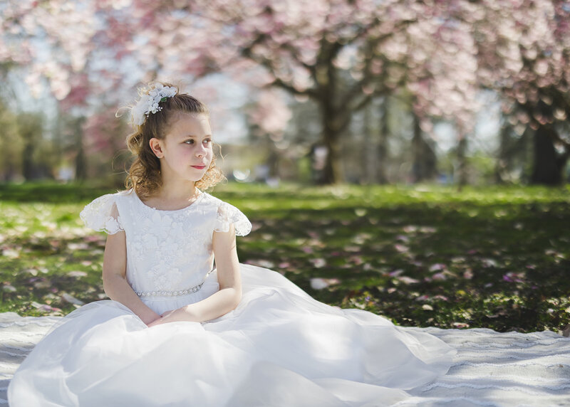 First Communion photo of girl in a NJ park.