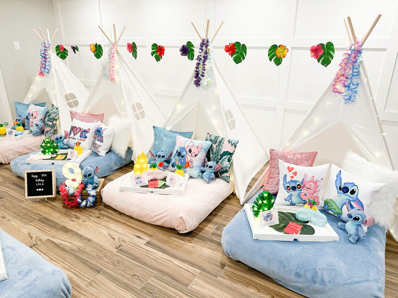 stitch themed slumber party decor with teepee beds