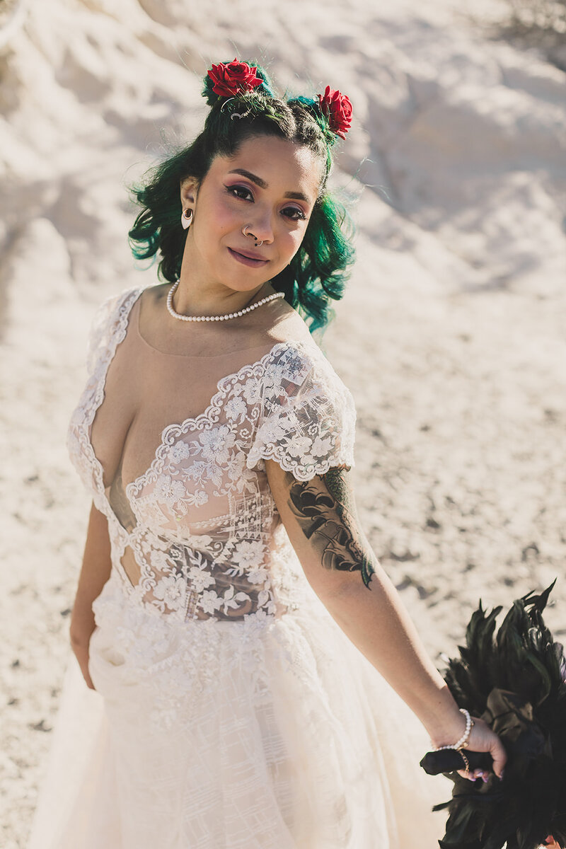 las vegas bride poses for portraits after wedding ceremony