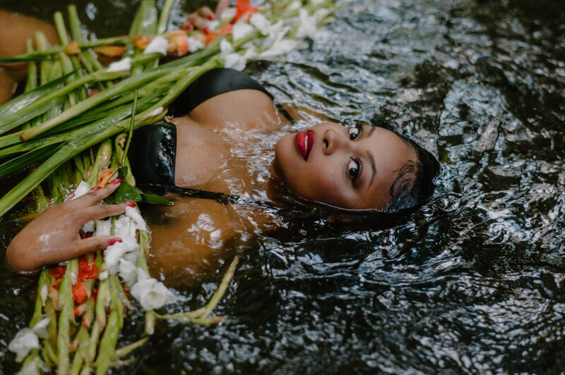 Rich black skin with red lip water boudoir