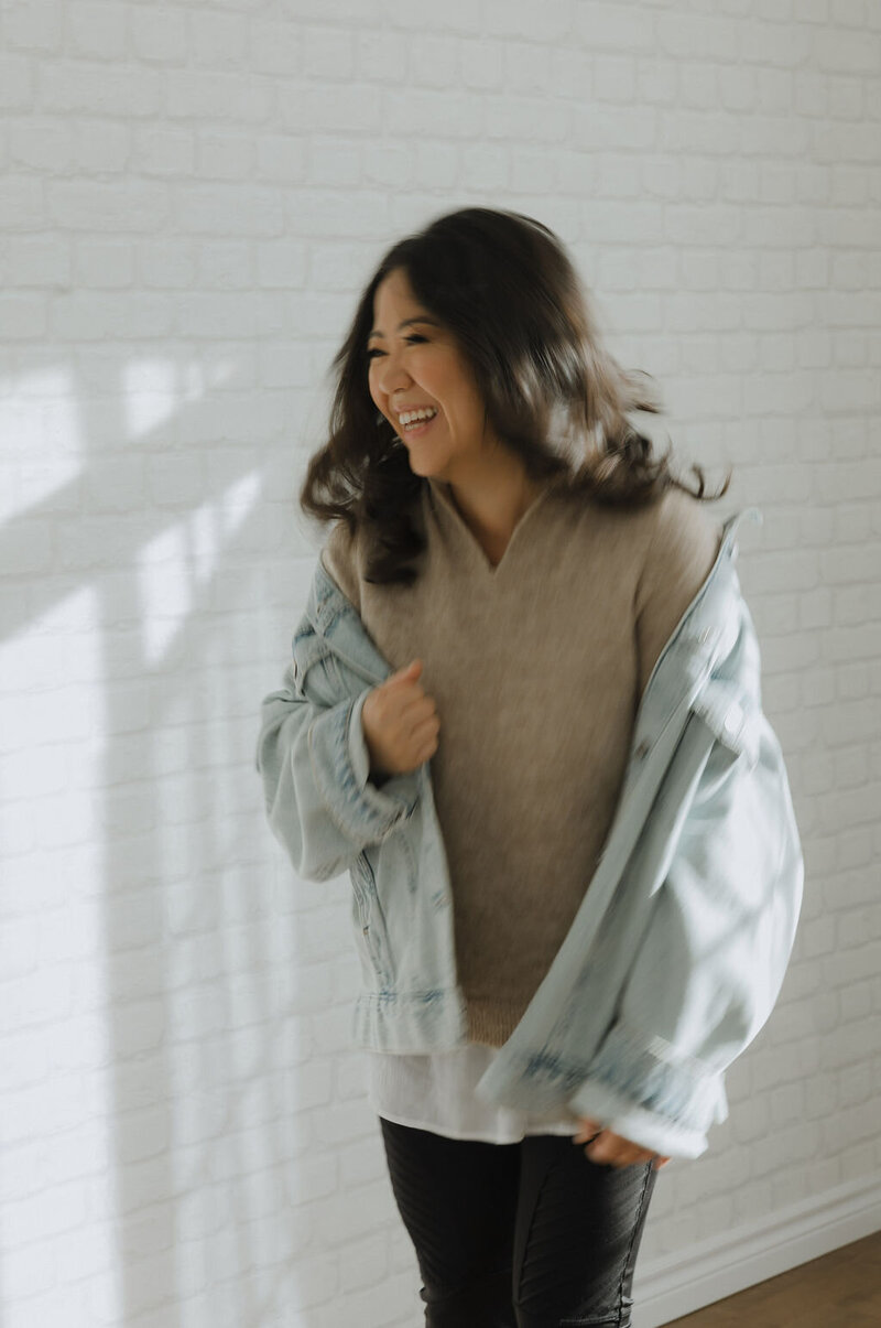 Asian smiling with jean jacket