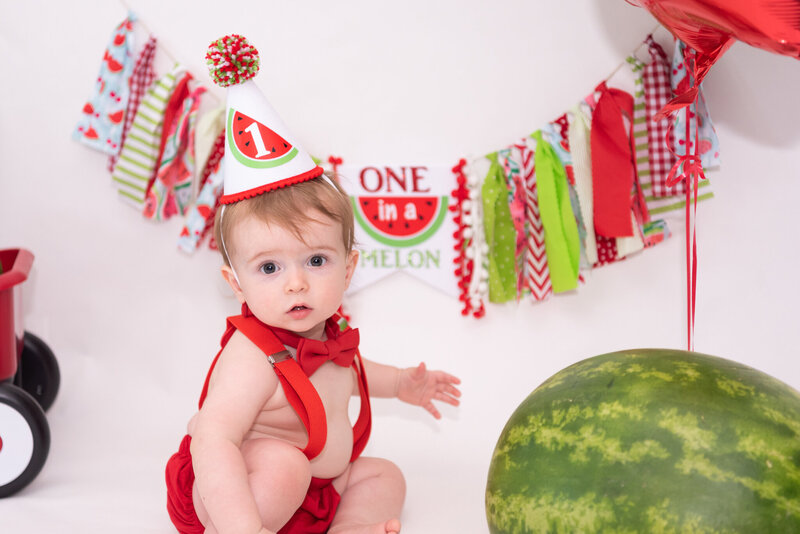 A one-year-old at his cake smash photo session.